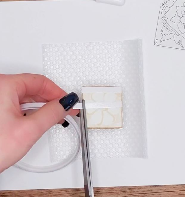 add double sided tape to back